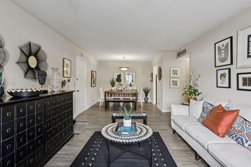 Nashville townhouse for rent - A living room with a white couch and a coffee table in the middle.