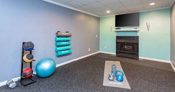 Fitness room with stretching area and mats