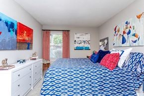 Norcross apartment for rent - a bedroom with a bed and paintings on the wall