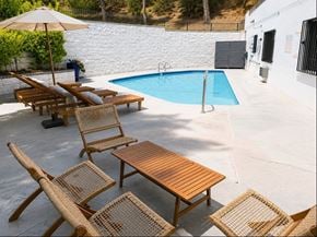 Sherman Oaks apartment for rent - A pool with a table and chairs around it.