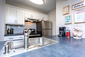 Norcross apartment for rent - Modern apartment kitchen with stainless steel appliances at Domain Apartments in Norcross, GA