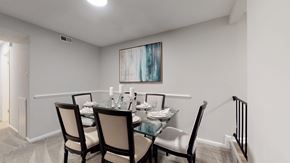 Silver Spring apartment for rent - A dining room with a glass table and chairs.