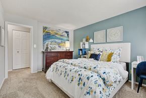 Bel Air apartment for rent - a bedroom with blue and white walls and a bed