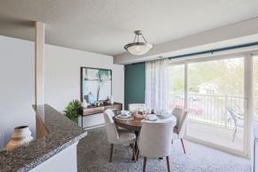 Bel Air apartment for rent - a dining area with a table and chairs and a large window