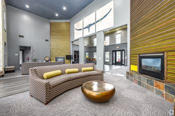 Resident lounge with fireplace, coffee and hot tea bar
