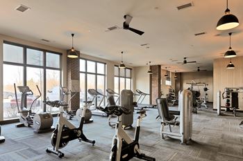 24-Hour fitness center with cardio, free weights & personal yoga/workout space