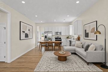 Knoxville apartment for rent - A modern living room with a grey sofa and a coffee table.