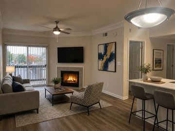 Indianapolis apartment for rent - A living room with a fireplace and a television mounted on the wall.