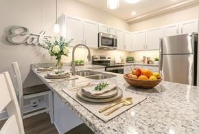 Clarksville apartment for rent - A modern kitchen with granite countertops and stainless steel appliances.
