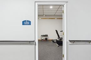 Florissant apartment for rent - A fitness center sign is on the wall.