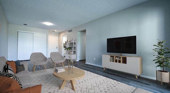 Columbus apartment for rent - a living room with blue walls and a flat screen tv on the wall