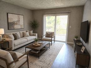 Louisville apartment for rent - A living room with a couch, chair, and coffee table.