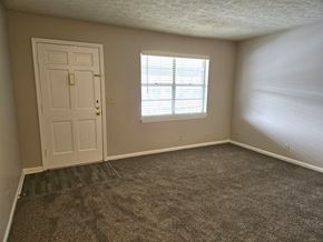 Louisville apartment for rent - an empty room with a door and a window