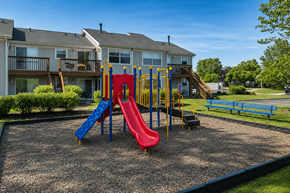 Crystal Lake apartment for rent - A playground with a red, yellow and blue slide.