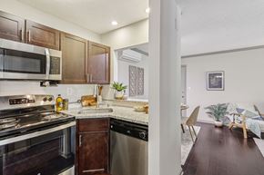 Louisville apartment for rent - A kitchen with a stove top oven and a dishwasher.