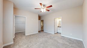 Elizabethtown apartment for rent - A spacious room with a ceiling fan and carpeted floor.