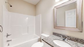Elizabethtown apartment for rent - A white bathroom with a sink, toilet, and bathtub.