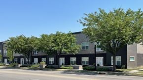 Clarksville apartment for rent - A row of modern houses with trees in front.