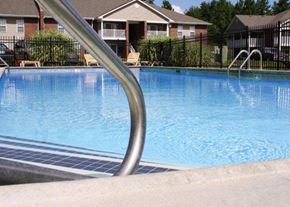Louisville apartment for rent - a large swimming pool with a metal railing