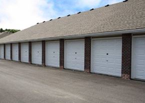 Louisville apartment for rent - a row of garage doors on the side of a building
