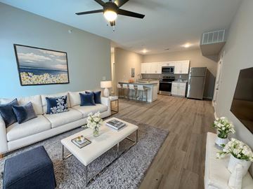 Louisville apartment for rent - A living room with a white couch and a coffee table.