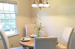 Peoria apartment for rent - a dining room with a table and chairs and a window