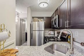 Louisville apartment for rent - A kitchen with stainless steel appliances at Avenue in the Highlands Apartments in Louisville