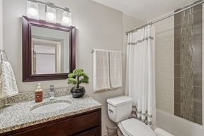 Louisville apartment for rent - A bathroom with toilet and sink  at Avenue in the Highlands Apartments in Louisville