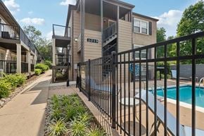 Louisville apartment for rent - An apartment pool with black fence in Louisville
