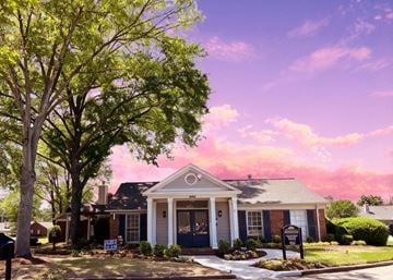 Memphis townhouse for rent - A house with a tree in front of it.