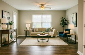 Buckner apartment for rent - A living room with a couch, chair, and table.
