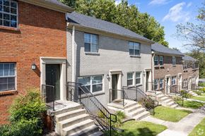 Frankfort townhouse for rent - A row of houses with a brick house on the left.