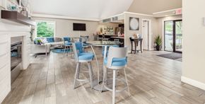 Maineville apartment for rent - A well-lit, spacious dining area with a fireplace and a television.