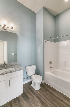 St. Louis townhouse for rent - a bathroom with a toilet and a tub and a sink