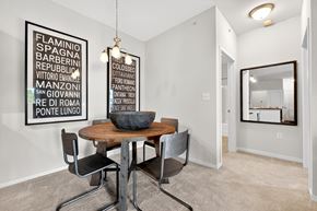 St. Charles apartment for rent - A dining room with a wooden table and chairs.