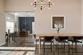 Wentzville apartment for rent - A dining room with a wooden table and chairs at Aventura at Wentzville I & II Apartments, Missouri, 63385