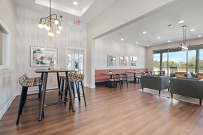Lake St Louis apartment for rent - A modern dining room with a wooden table and chairs.