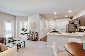 Living room with a kitchen and dining area
