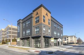 St. Louis townhouse for rent - a brick and wood building on the corner of a city street