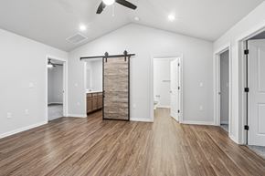 Sturgeon Bay apartment for rent - A room with a sliding door and hardwood floors.