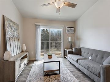 Howard apartment for rent - A living room with a grey couch and a coffee table.