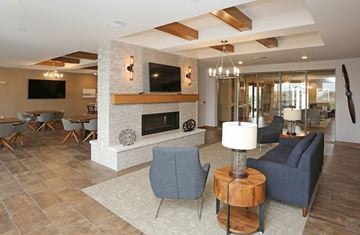Howard apartment for rent - a living room with couches and chairs and a fireplace