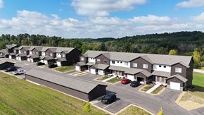 Green Bay apartment for rent - a aerial view of a group of houses and a parking lot