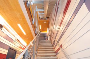 Lakewood apartment for rent - A staircase with a wooden ceiling and white walls.