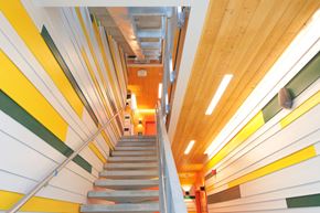Lakewood apartment for rent - A staircase with a yellow and green striped wall.