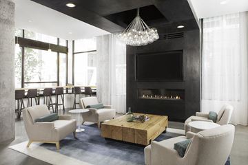 Seattle apartment for rent - a living room with chairs and a coffee table and a fireplace