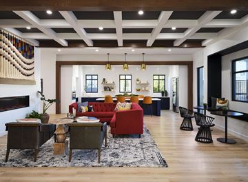 Murrieta apartment for rent - A living room with a red couch and a fireplace.