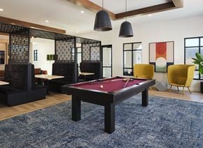 Murrieta apartment for rent - A pool table is in the middle of a room with a blue rug.