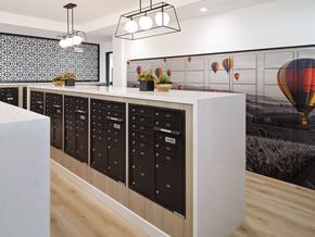 Murrieta apartment for rent - A modern kitchen with a long counter and a wall mural of hot air balloons.