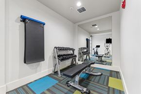 Richland apartment for rent - A gym room with a row of exercise equipment.